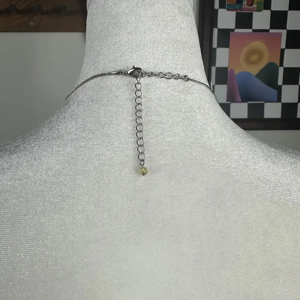 Lia Sophia Silver Tone Retro Style Long Necklace‎ with Yellow Rotating Gems